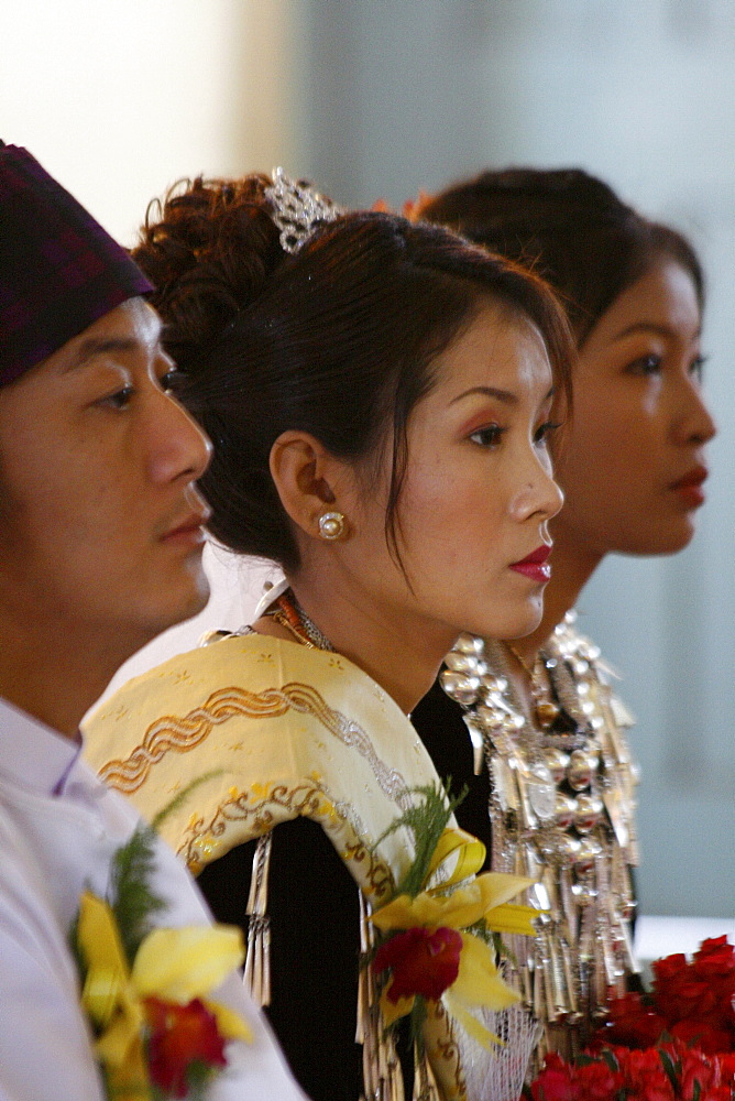 Myanmar bride groom friends at a catholic wedding of tribal kachins at myitkyina, a largely kachin community in north burma near chinese border 