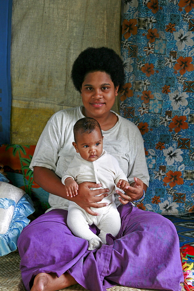 Fiji elerna wayeli, 17, and her daughter angela, taveuni photo by sean sprague