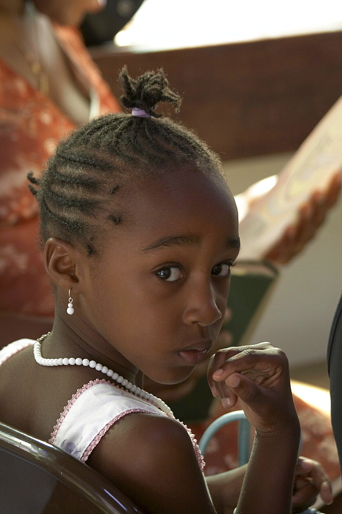 Jamaica. Girl at sunday mass at catholic church in chester castle