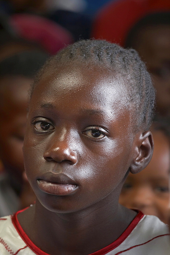 Kenya. Faces of the congregation at catholic mass in mukuru ruben, a slum of nairobi