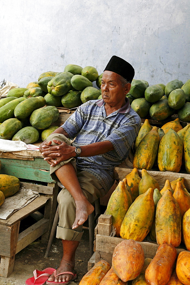 Indonesia man selling papayas, banda aceh, aceh, 2 years after the tsunami