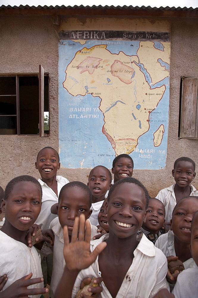 Tanzania children at school in front of africa map, kalabezo