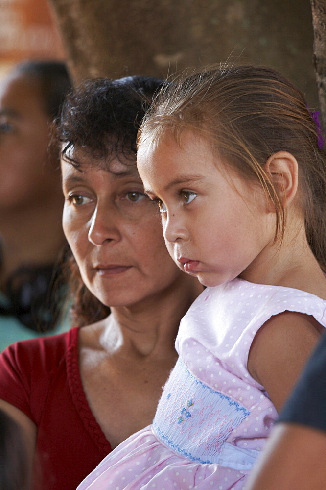 El salvador el mozote, site of the massacre of children in 1981. faces at at memorial celebration