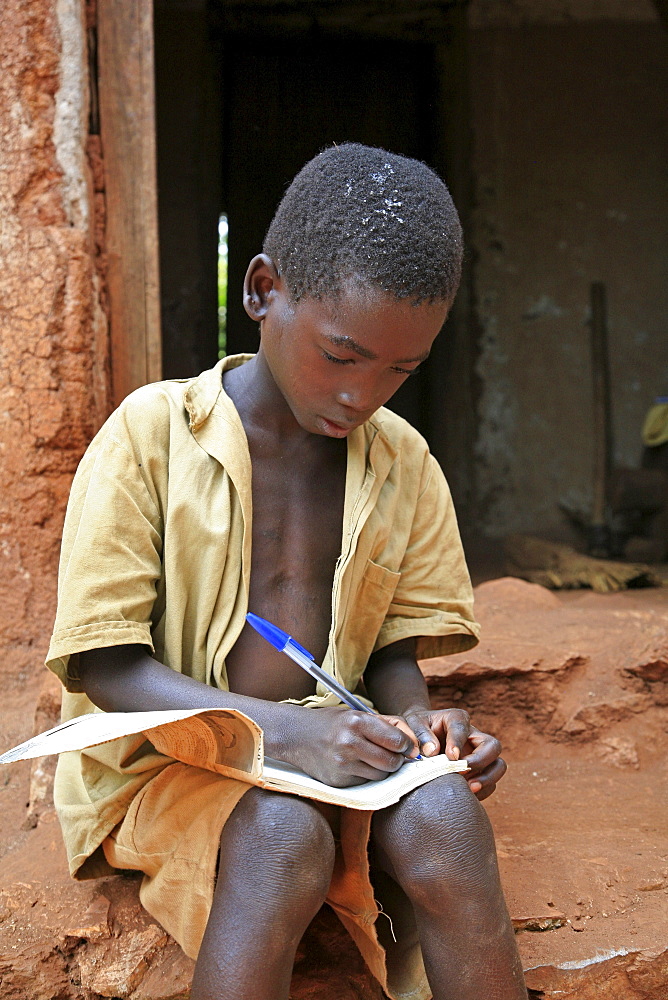 Burundi boys doing their homework after school, gitera.