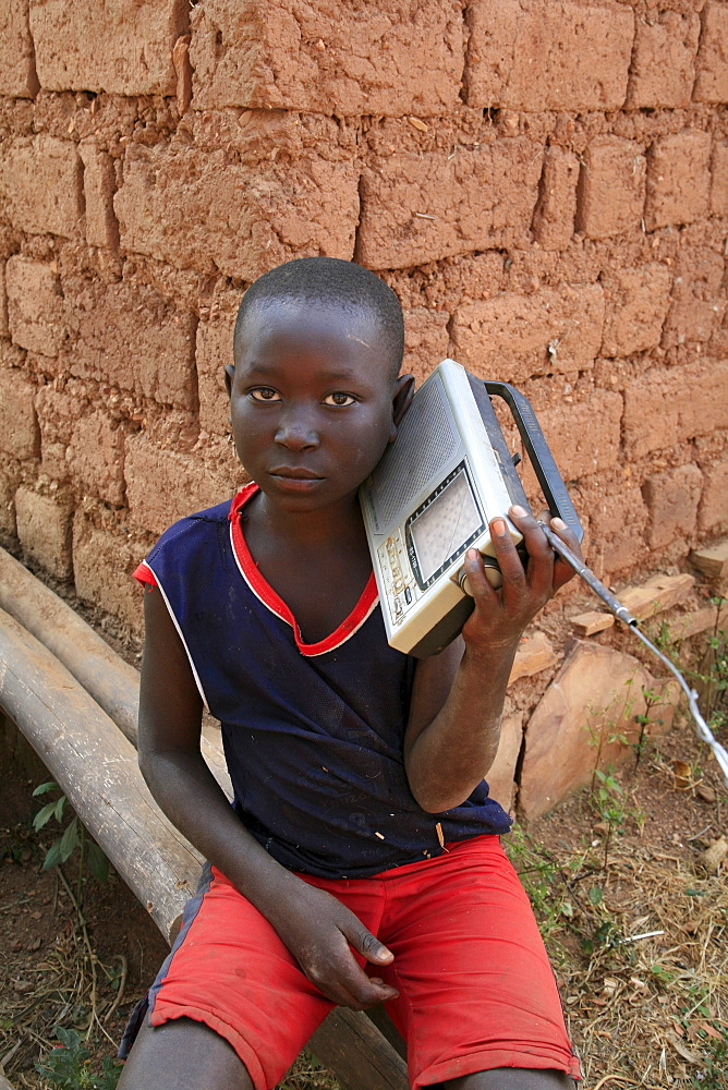 Burundi boy with radio, gitera.