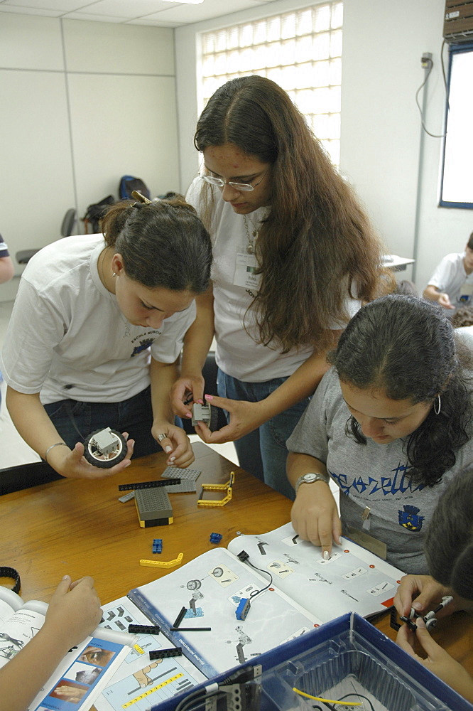 Education, brazil. Teenagers learning the basics of robotics at a course for poor in petropolis