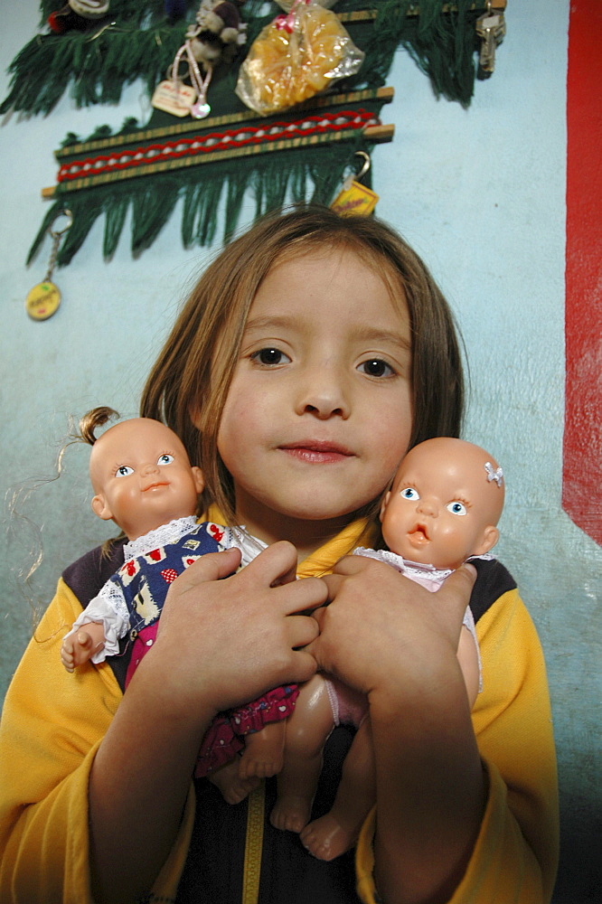 Colombia girl with her dolls. Altos de cazuca, bogota