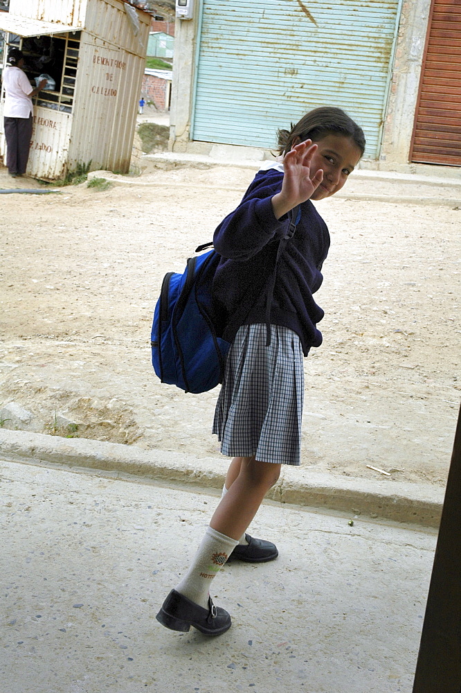 Colombia marly juliet, 7, of the slum of altos de cazuca, bogota, heading off to school