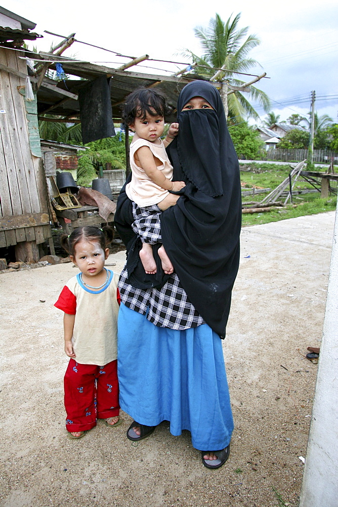 Thailand muslim woman with her children, pattani