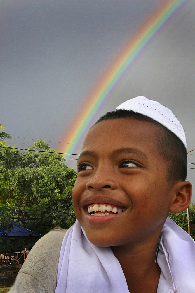 Thailand muslim boy of pattani. Composite photo with rainbow