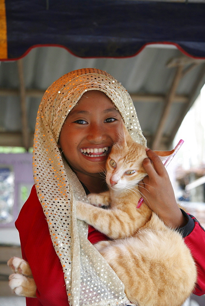 Thailand moslem girl with cat. Pattani