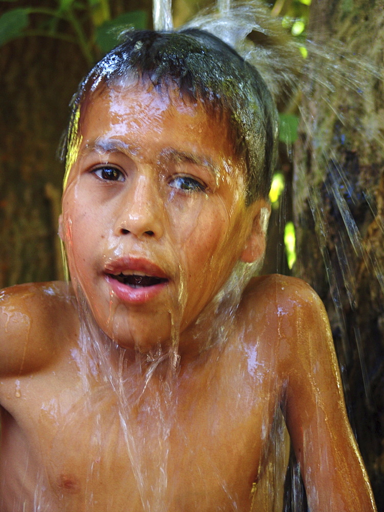 Honduras boy taking a bath, agua caliente, copan