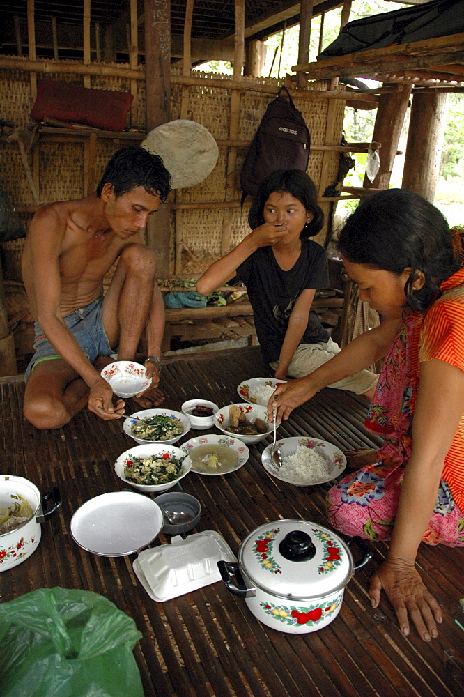 Cambodia family eating meal, kampong cham