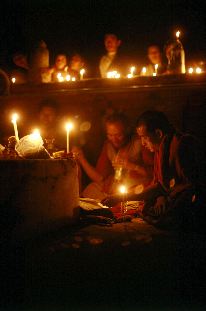 Monks offer butter lamps prayer, kalachakra initiation, bodhgaya. India. Monks attending kalachakra initiation at mahaboudhi temple in bodhgaya, india. mahabodhi temple marks site of buddhaâ€šÃ„Ã´s enlightment twenty-five hundred years. centuries have made pilgrimages across himalayas to sites connected with life of historical buddha. From a tantric perspective, pilgrimage is more than paying homage at sacred sites. Rather, it is that activities performed at these places become a memory of place itself. By attuning oneself through ritual meditation to this timeless presence, similar experiences be evoked