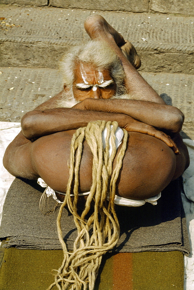 Sadhu doing yoga at hindu temple pashupati nath, nepal 