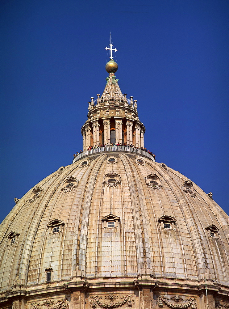 Tourists between the lantern and dome of St. Peter's Basilica in the Vatican, Rome, Lazio, Italy, Europe