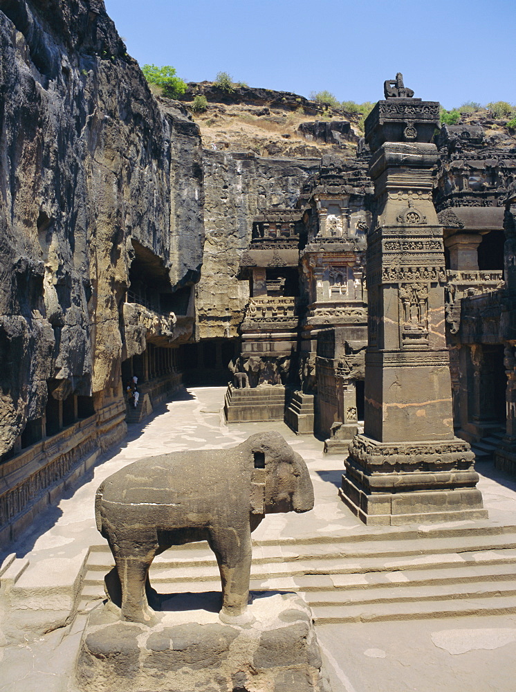 Massive elephant and column in NW of courtyard, Kailasa temple, Ellora, Maharashtra, India 