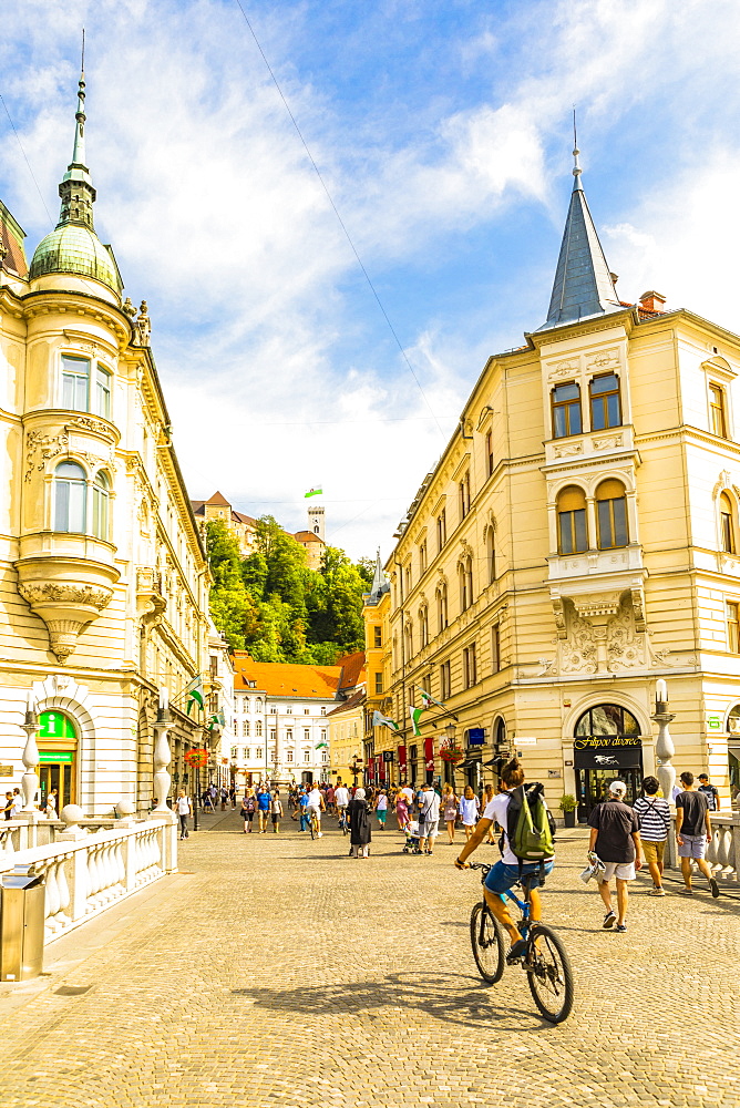 View from Plaza Presernov over Triple Bridge toward Ljubljana Castle, Ljubljana, Slovenia, Europe