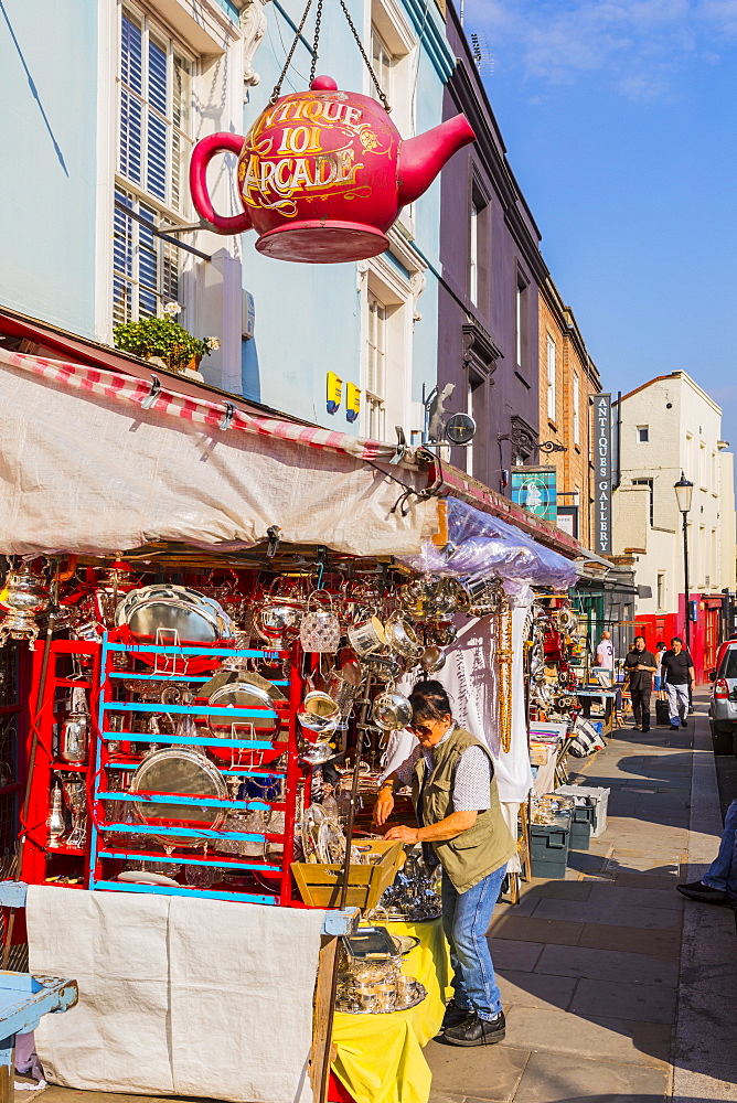 Woman shopping for antiques at Portobello Market, Kensington & Chelsea, London, England, United Kingdom, Europe