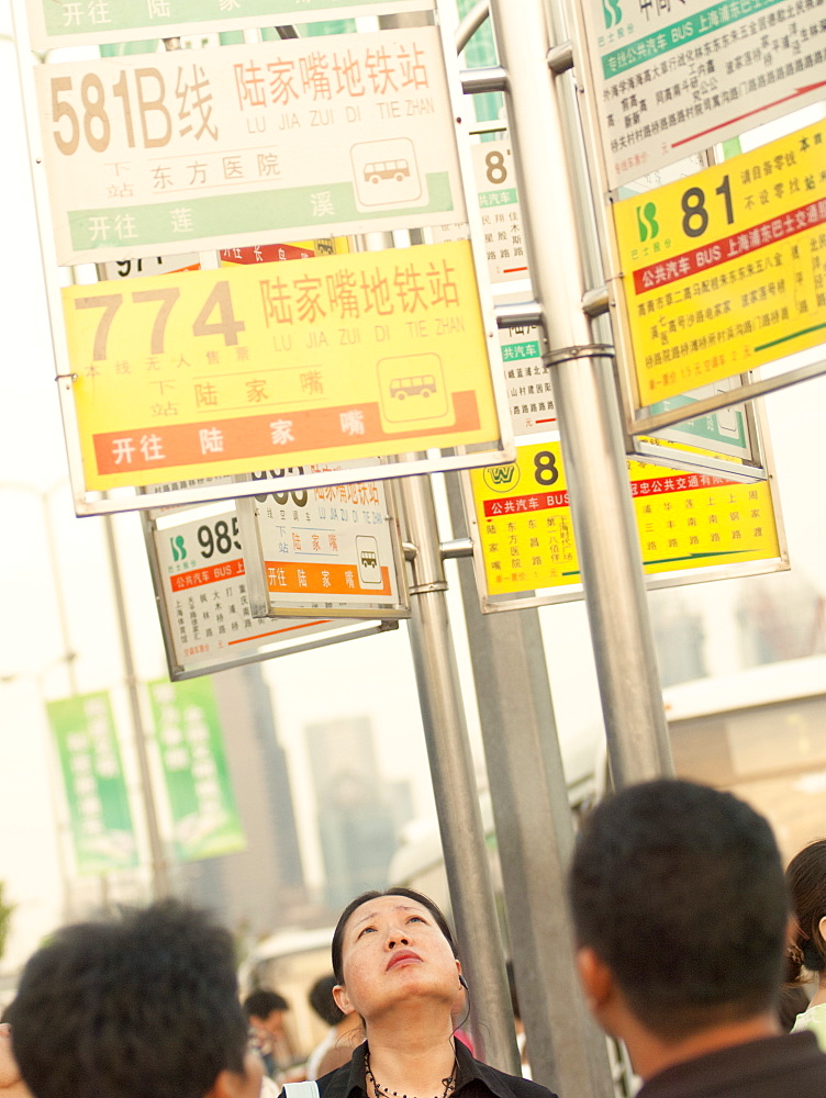 Commuters waiting for buses, Shanghai, China, Asia