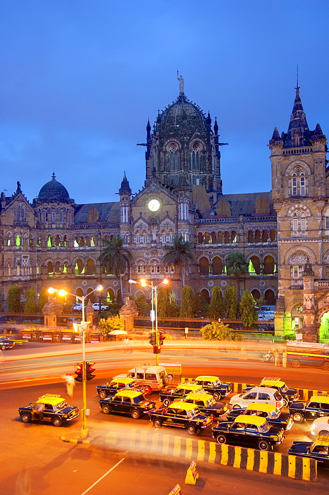 Taxis and Victoria Terminus, Mumbai (Bombay), India, South Asia