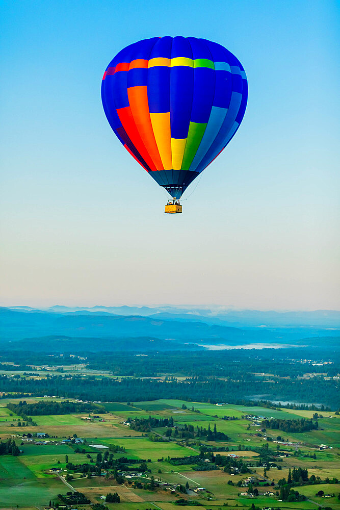 Hot air balloon over Auburns farmland, Washington State, United States of America, North America