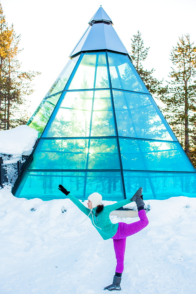 Woman doing yoga, glass teepee, Kakslauttanen Igloo Village, Saariselka, Finland, Scandinavia, Europe