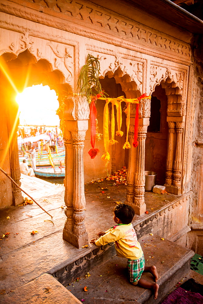 Little Indian boy watching the Traditional Krishna and Radha dance during the Flower Holi Festival, Vrindavan, Uttar Pradesh, India, Asia