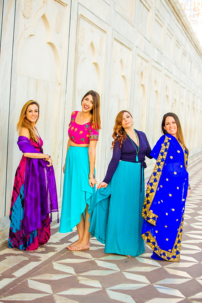 Tourists in saris standing in front of the Taj Mahal, Agra, Uttar Pradesh, India, Asia