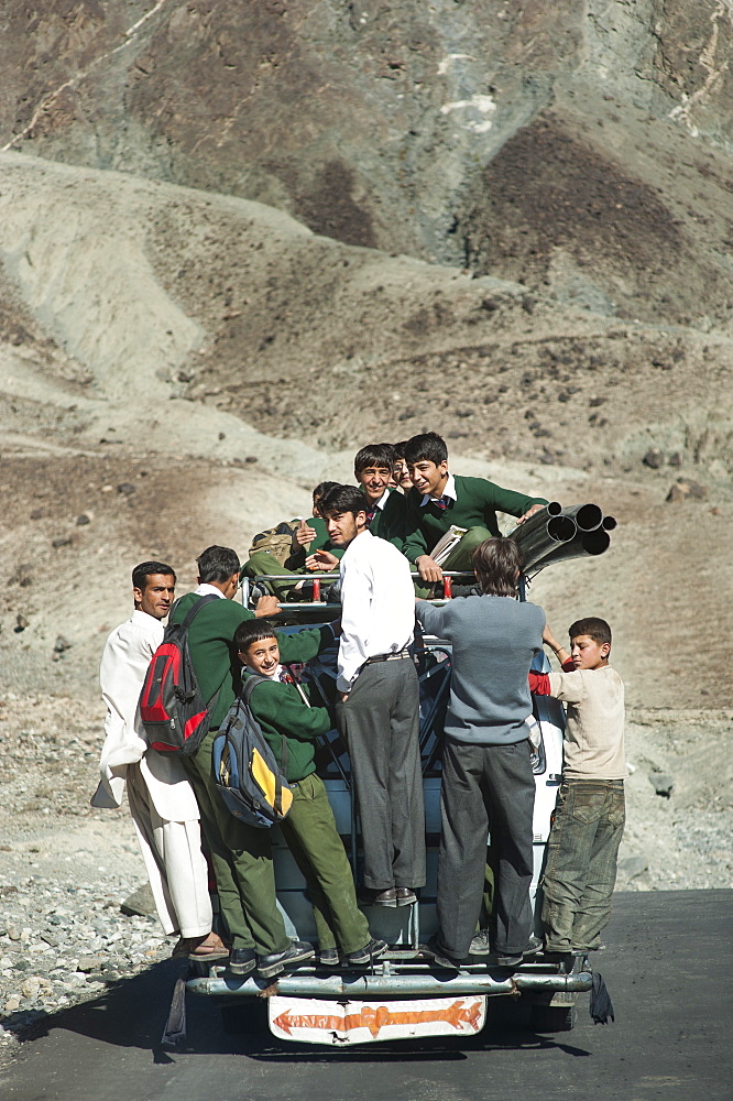 Children overload a local bus to get to school , Gilgit-Baltistan, Pakistan, Asia