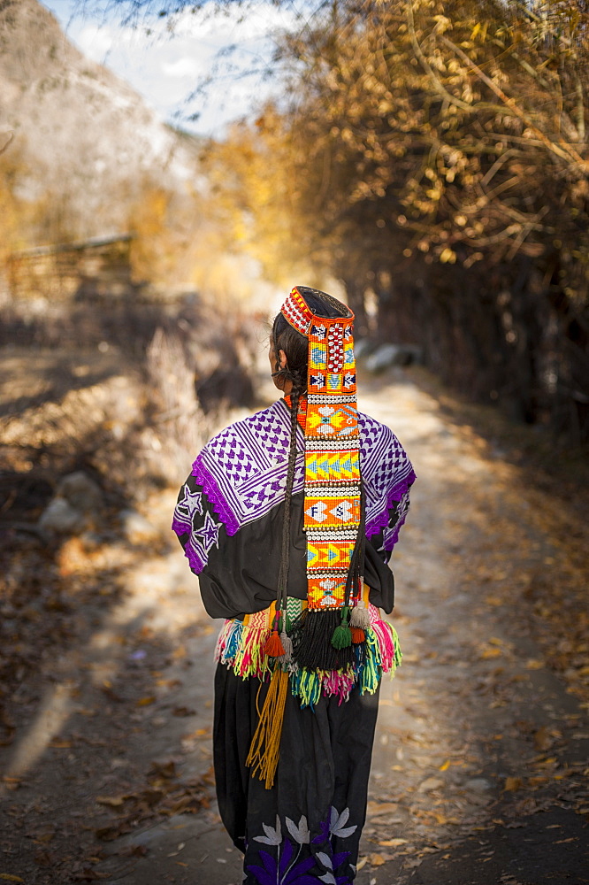 Kalasha woman from Kalasha valley wearing traditional dress, North West Frontier Province, Pakistan, Asia