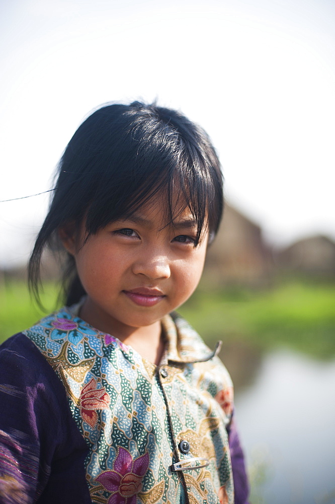 A little girl living in a floating village on Inle Lake in Myanmar (Burma), Asia