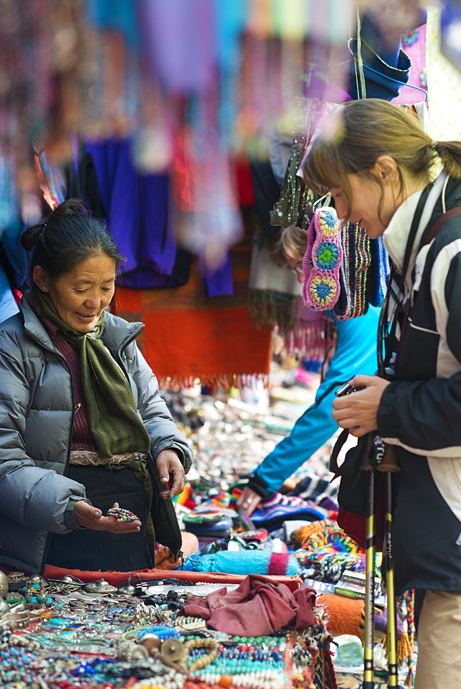 Shopping for souvenirs in Namche Bazaar, the main town during the Everest base camp trek, Nepal, Asia