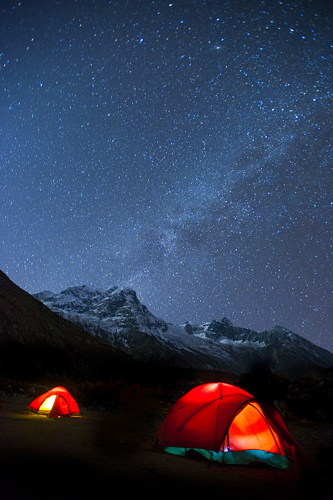 Glowing tents at Samogaon on the Manaslu circuit trek, Himalayas, Nepal, Asia