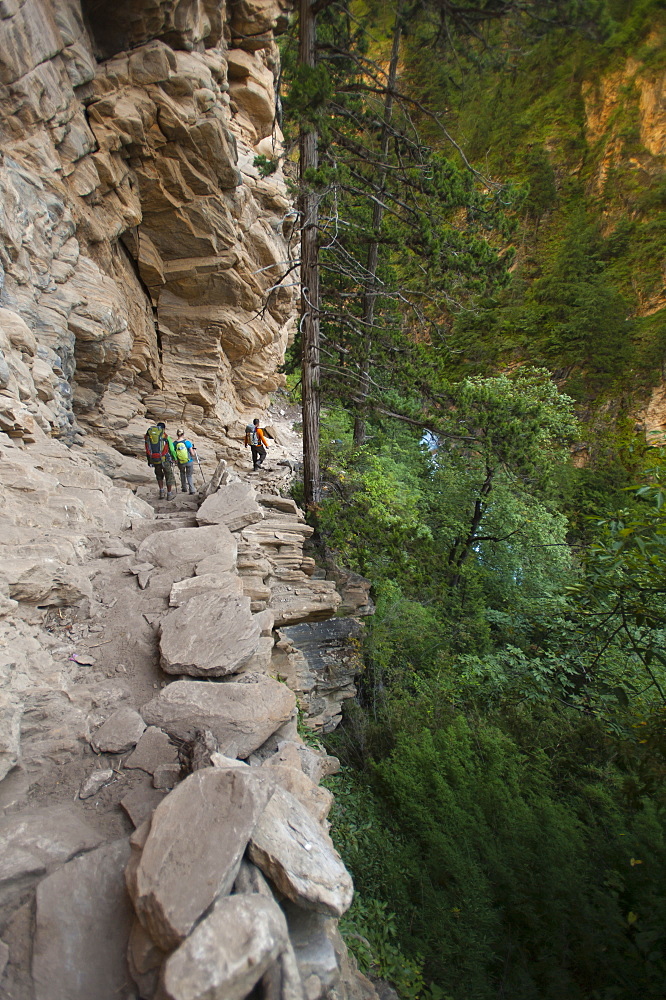 A trekking group makes their way into Dolpa beside the Suli Gadd between Chhepka and Amchi Hospital, Nepal, Asia