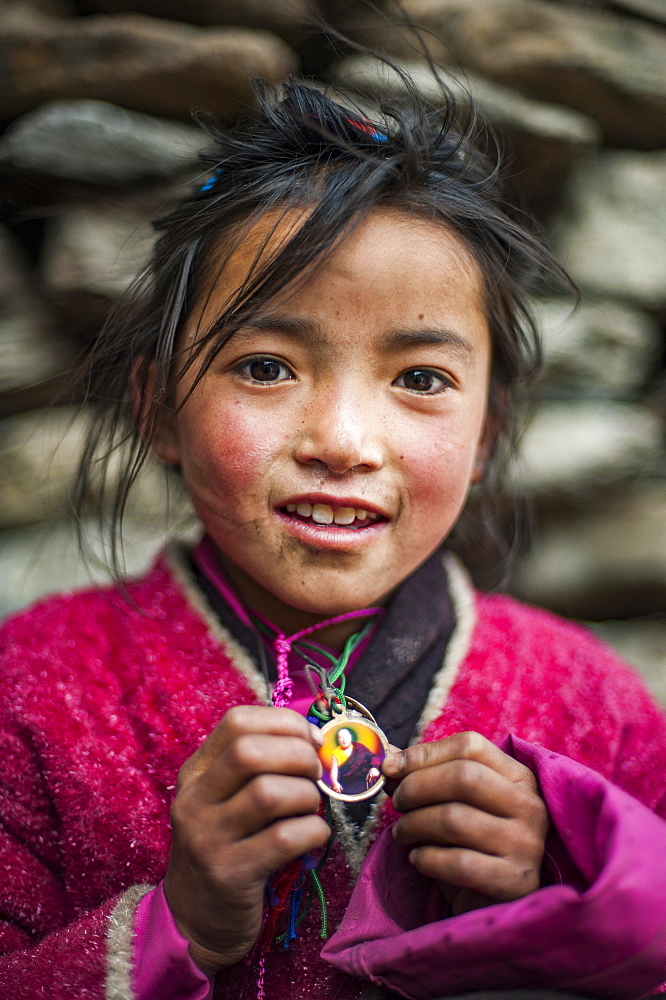 A little Buddhist girl in the Tsum Valley, Manaslu region, Nepal, Asia