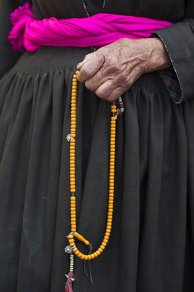 108 beads are strung on a garland of Buddhist prayer beads, with the beads typically made of fragrant wood like sandalwood, Ladakh, India, Asia