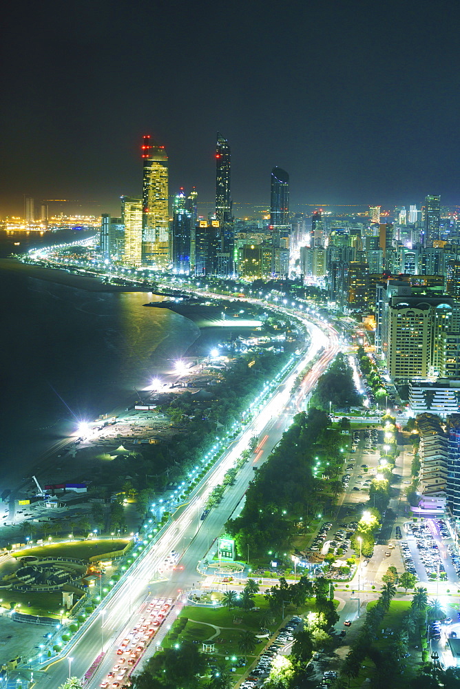 Skyline and Corniche, Al Markaziyah district by night, Abu Dhabi, United Arab Emirates, Middle East