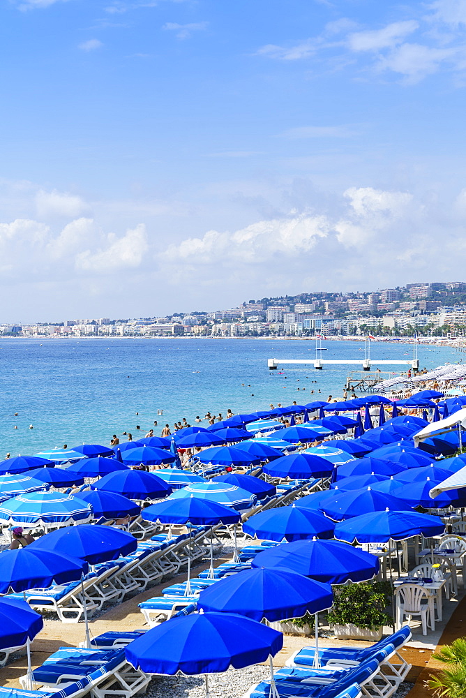 Blue parasols on the beach, Promenade des Anglais, Nice, Alpes Maritimes, Cote d'Azur, Provence, France, Mediterranean, Europe