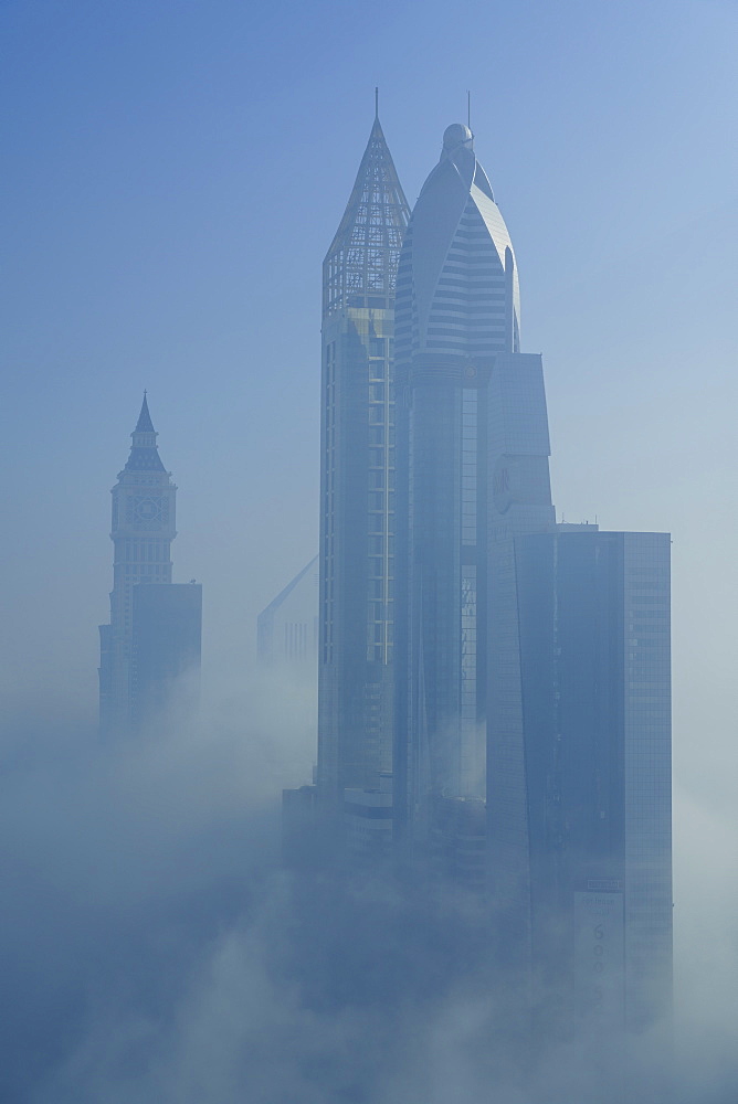 A foggy morning shrouds skyscrapers in Dubai, United Arab Emirates, Middle East