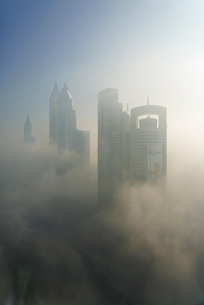 A foggy morning shrouds skyscrapers in Dubai, United Arab Emirates, Middle East