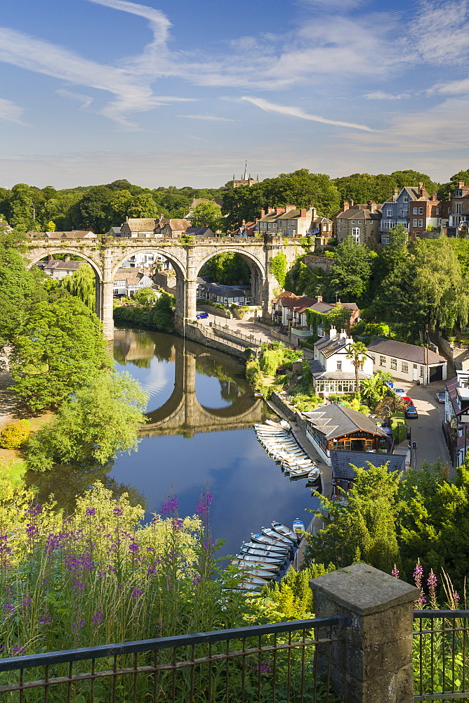 Rowing boats and viaduct over the River Nidd in lower Nidderdale on a mid-summer sunny day, Knaresborough, Borough of Harrogate, North Yorkshire, England, United Kingdom, Europe