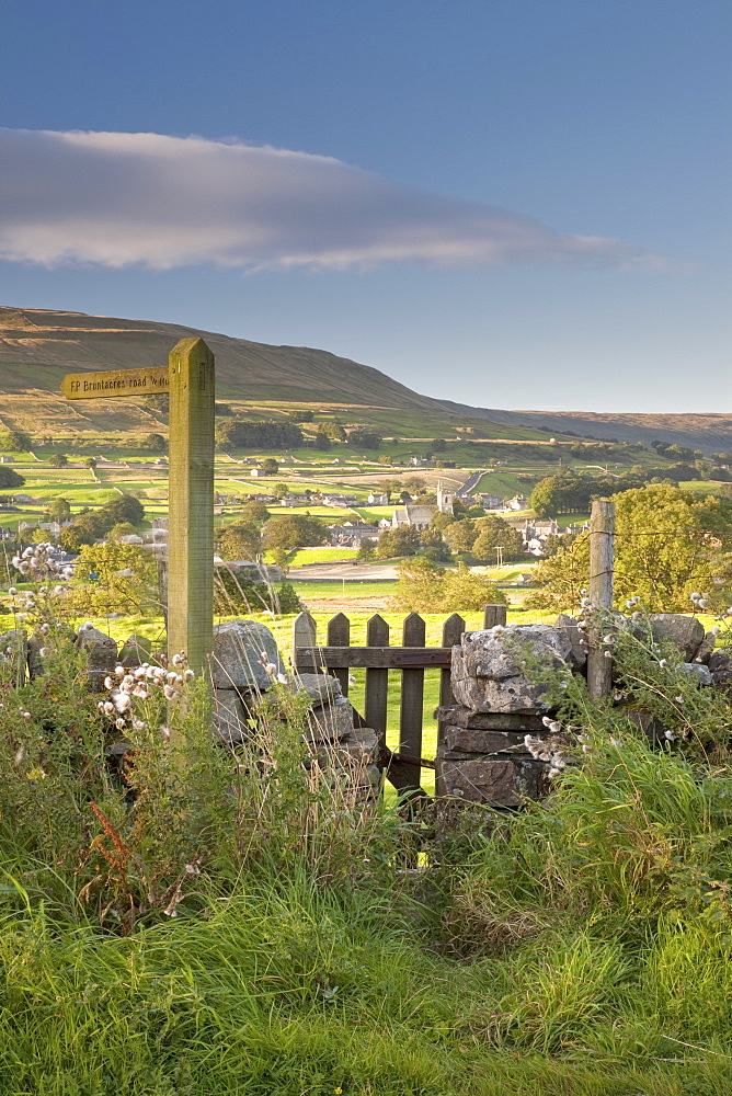 A footpath signpost and gate leading to Hawes village in Wensleydale, The Yorkshire Dales, Yorkshire, England, United Kingdom, Europe