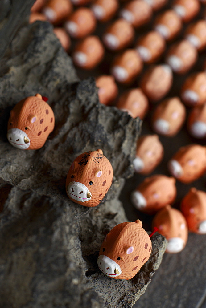 Small porcelain hogs as votive offerings, Marishisonten-do temple, Kyoto, Japan, Asia