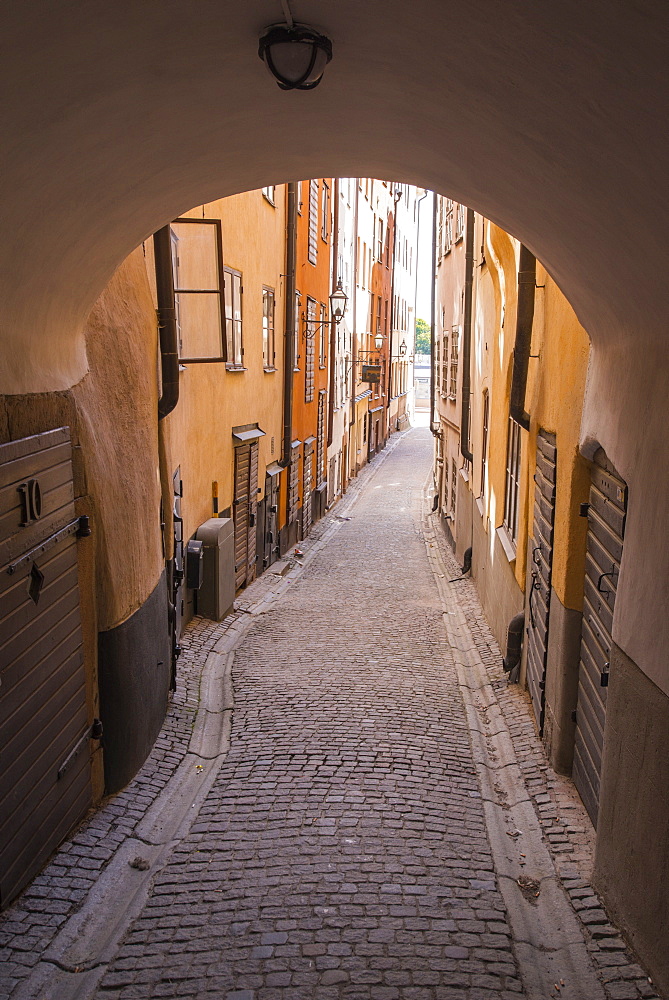 Arch and cobblestone alley in historic Gamla Stan, Stockholm, Sweden, Scandinavia, Europe