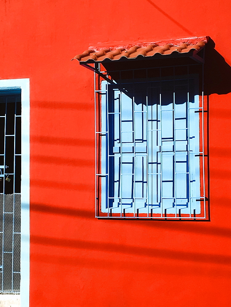 Red house with blue window, Cartagena, Colombia, South America