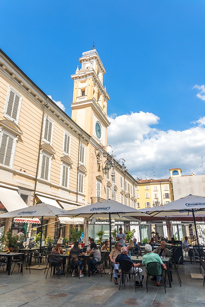 Customers enjoy an afternoon at a cafe in the centre of Parma, Emilia-Romagna, Italy, Europe