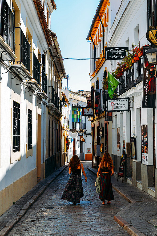 Tourists in narrow pedestrian streets of Cordoba, Andalucia, Spain, Europe