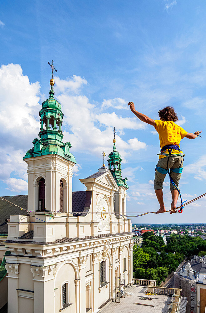 Highlining with Cathedral in the background, Urban Highline Festival, Lublin, Lublin Voivodeship, Poland, Europe