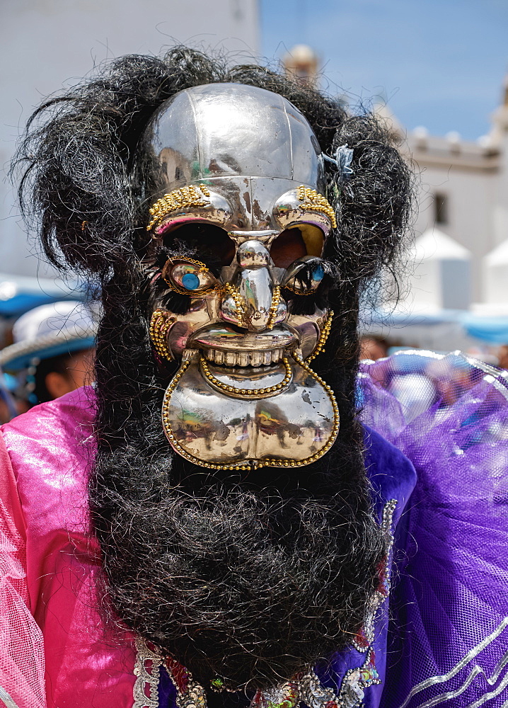 Masked dancer in traditional costume, Fiesta de la Virgen de la Candelaria, Copacabana, La Paz Department, Bolivia, South America